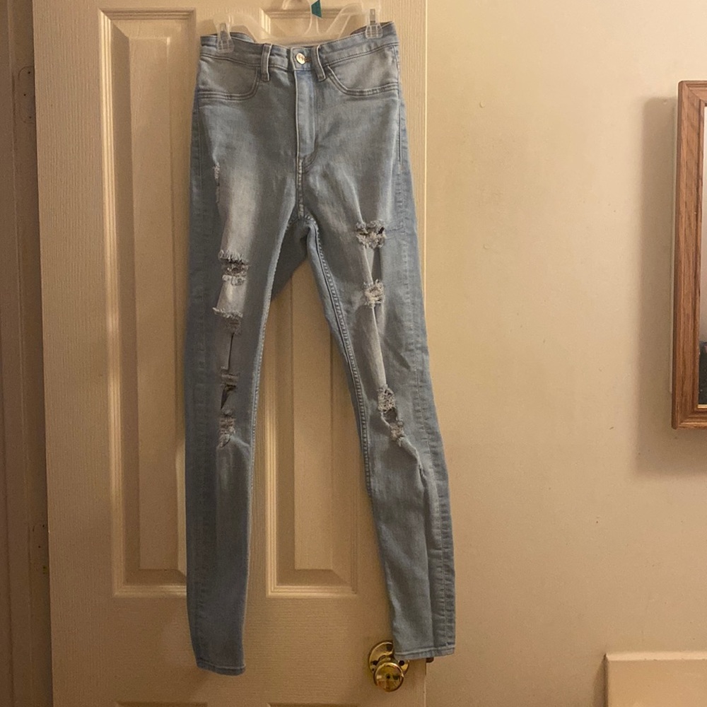 Distressed light blue jeans
